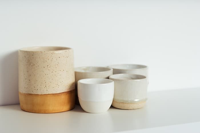 Hand-thrown stoneware cups and a bowl in matte and gloss glazes