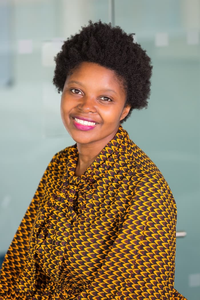 Portrait of Amara Nwosu of Blue Ridge Glassworks in the shop
